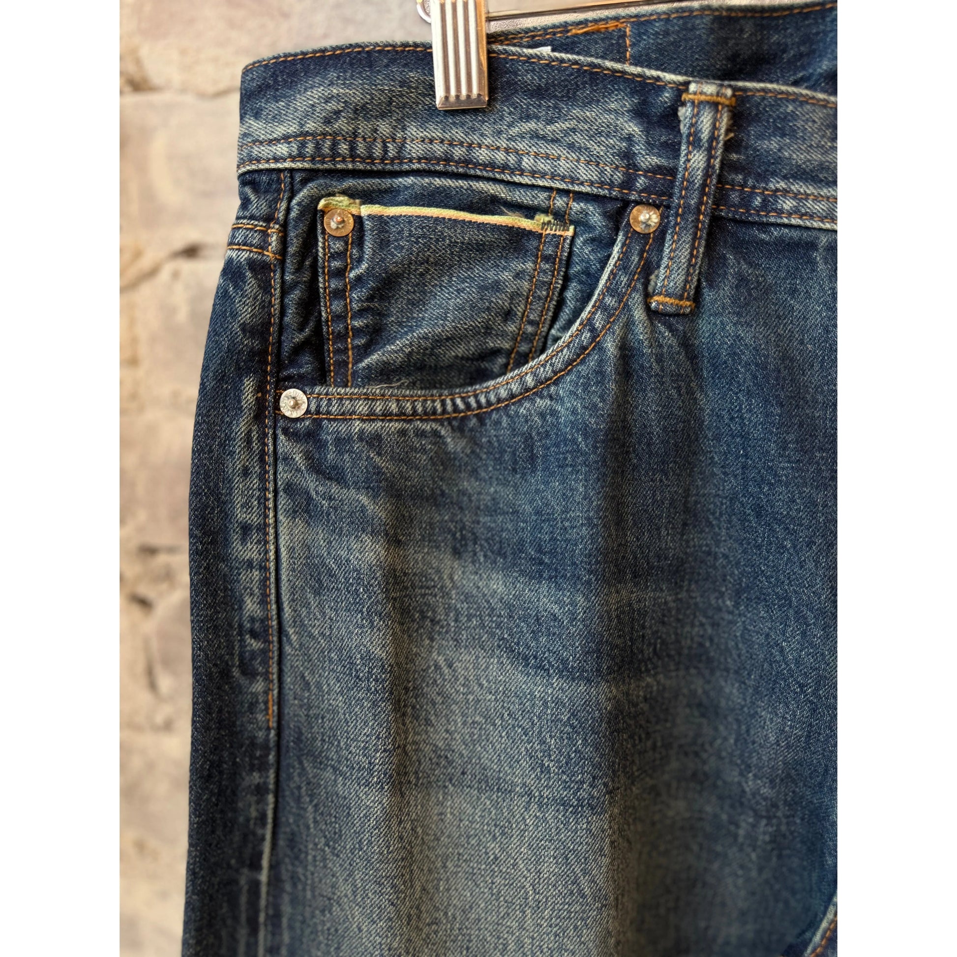 Edwin Akita Regular Tapered 13.5oz selvedge denim jeans in Sagano wash, men's fit, shown folded with visible stitching details.