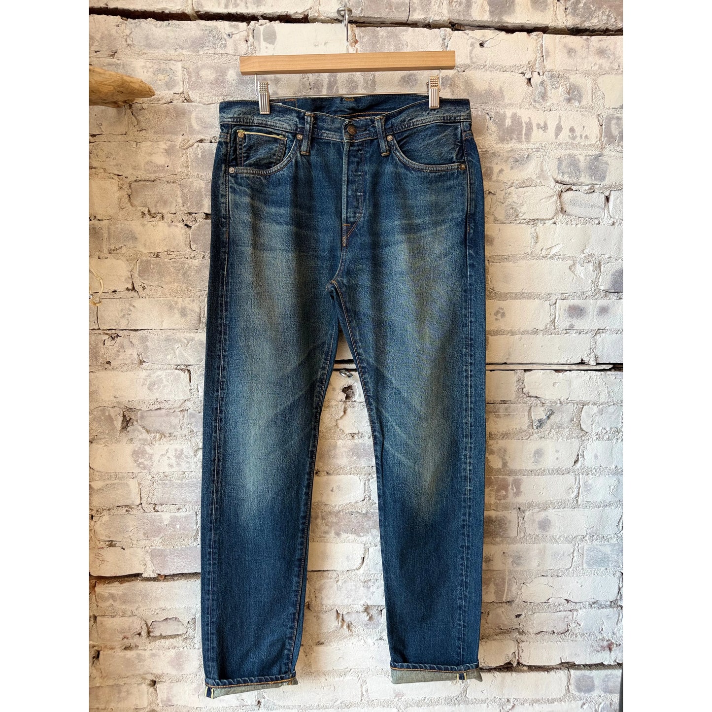 Men's Edwin Akita Regular Tapered 13.5oz Selvedge jeans with Sagano wash, showing detailed denim texture and tapered fit.