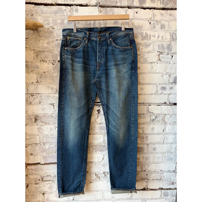 Men's Edwin Akita Regular Tapered 13.5oz Selvedge jeans with Sagano wash, showing detailed denim texture and tapered fit.