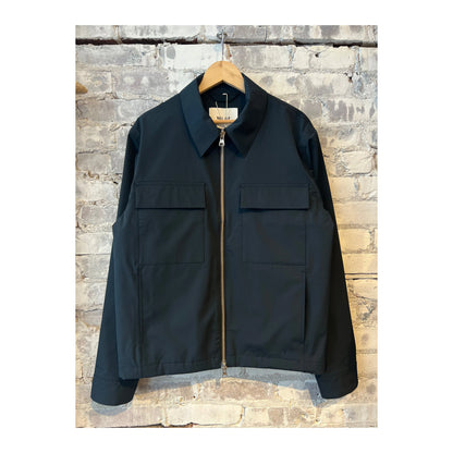 Men's navy blue Alban Technical Jacket by NN07, showcasing the lightweight, water-resistant outer layer with a full front zipper.