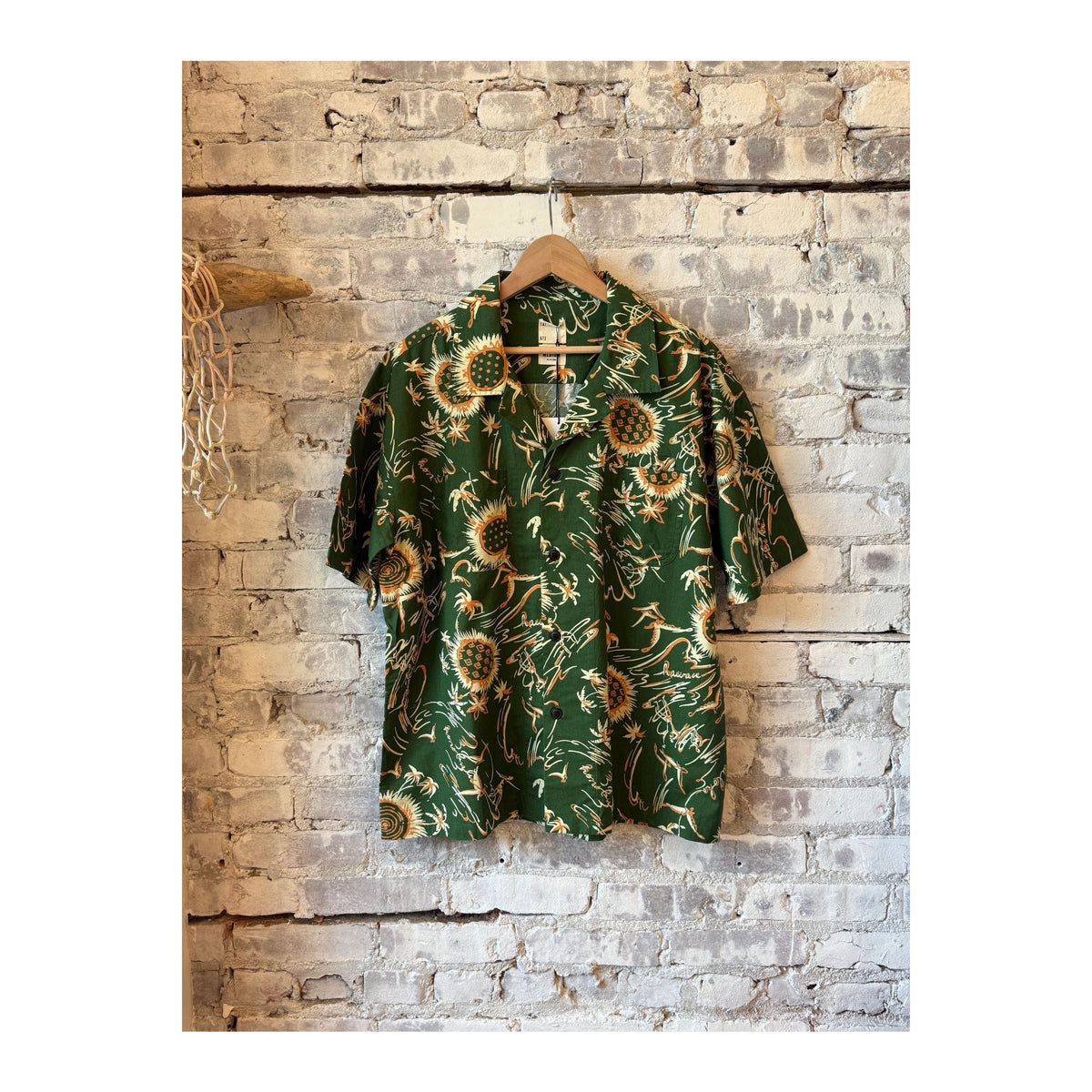 Men's green Aloha shirt with Casa print by Eat Dust, featuring vibrant tropical design and casual fit.