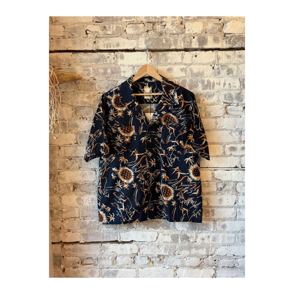 Men's navy Aloha shirt with Casa print by Eat Dust, featuring tropical-inspired design and casual short-sleeve fit.
