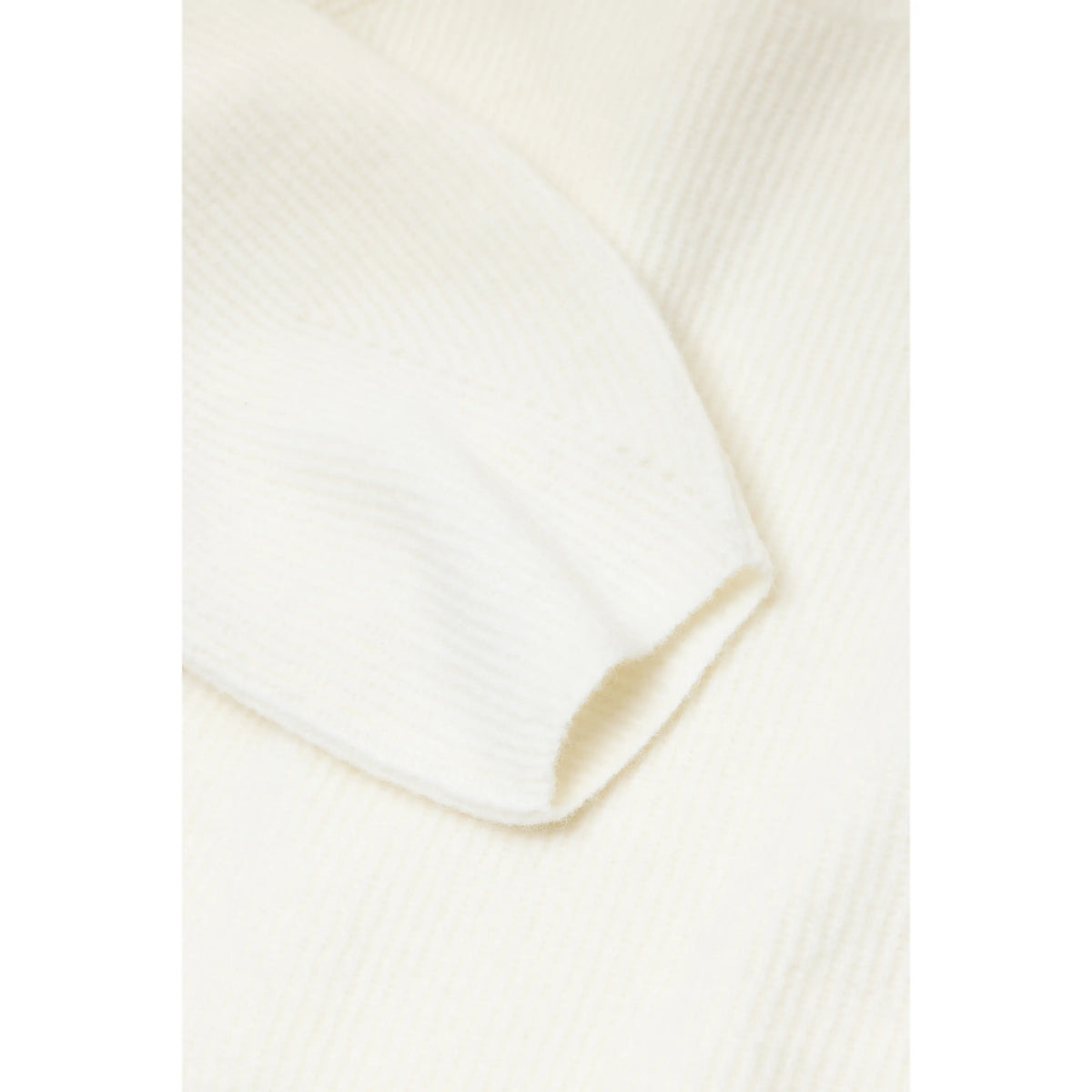 Women's alpaca-wool-blend jumper in whipped cream color, featuring a cozy, soft knit with a relaxed fit and ribbed cuffs.