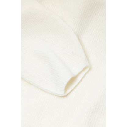 Women's alpaca-wool-blend jumper in whipped cream color, featuring a cozy, soft knit with a relaxed fit and ribbed cuffs.