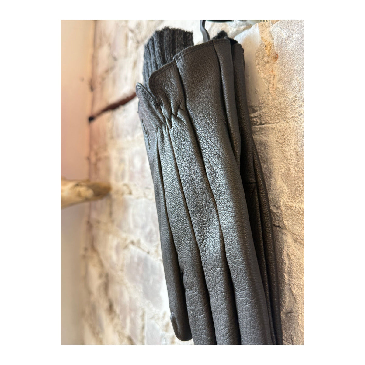 Women's Hestra Amber Leather Glove in black, showcasing the sleek design and soft leather material.