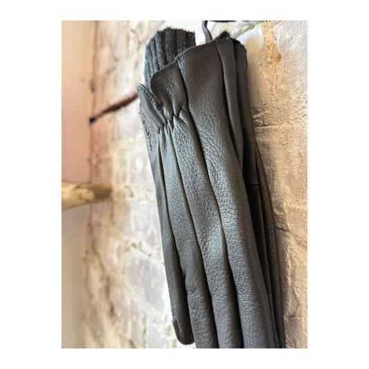Women's Hestra Amber Leather Glove in black, showcasing the sleek design and soft leather material.
