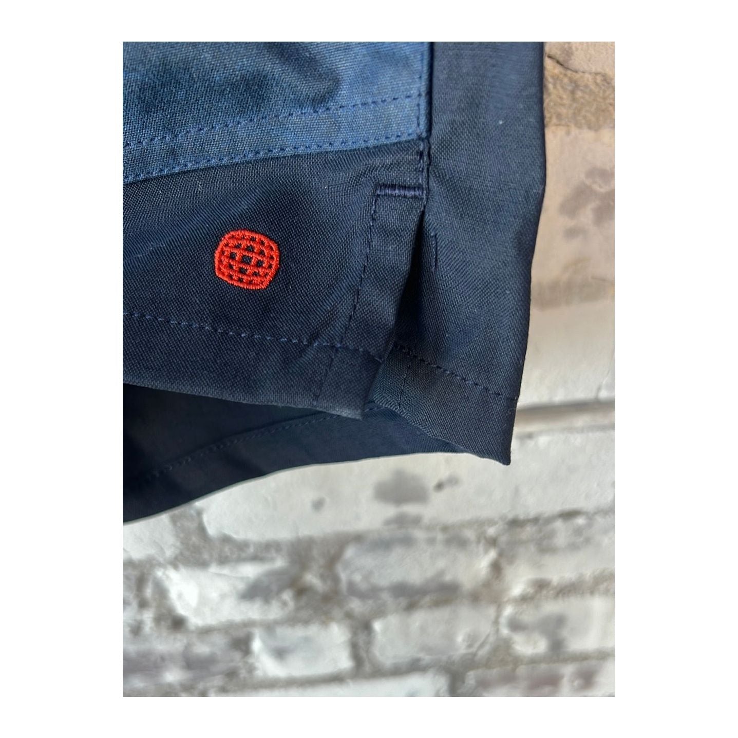Men's 7-inch Field Shorts by Amundsen in faded navy and navy with adjustable waist and cargo pockets.