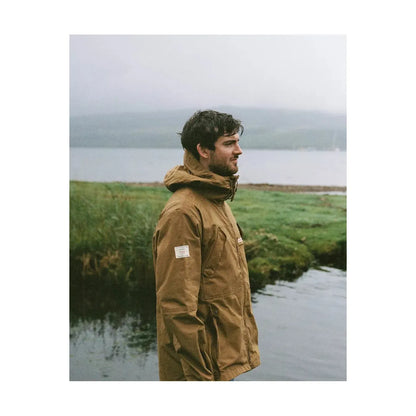 Men's Amundsen Vidda Jacket in camel, shown in a stylish outdoor setting with its durable fabric and classic design.