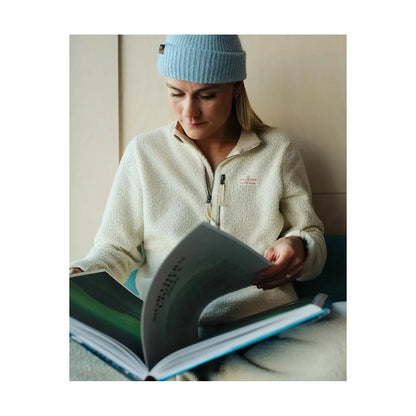 Women's Amundsen Hut Half Zip in oatmeal, showcasing the cozy fleece fabric and half-zip design for outdoor comfort.