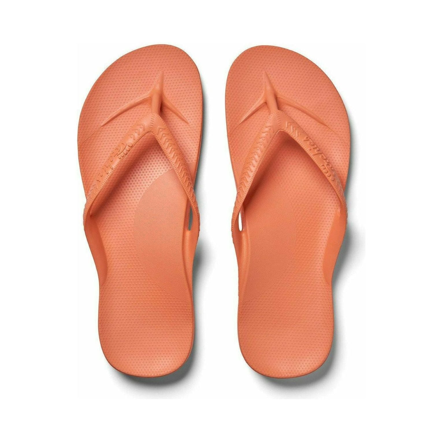 Archies peach flip-flops with arch support and casual footwear design, featuring open-toe style and comfortable sole.
