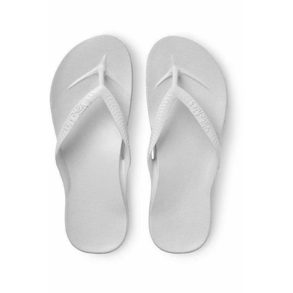 White Archies M6/W7 flip-flops with arch support, showcasing comfortable footwear design and casual style.