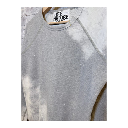 Women's Heather Bleachout raglan shirt by Freecity with heathered fabric and casual style, shown in the image.