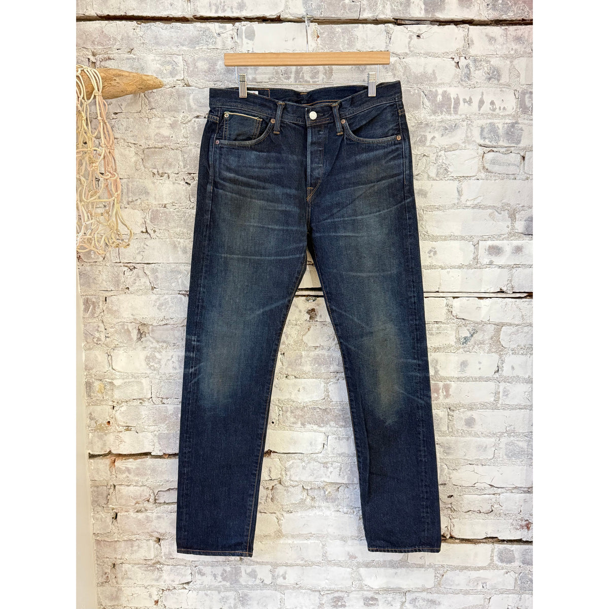 Men's Edwin Atika Straight 13.5oz selvage denim jeans in dark wash with 90-day wash finish, visible stitching and classic fit.