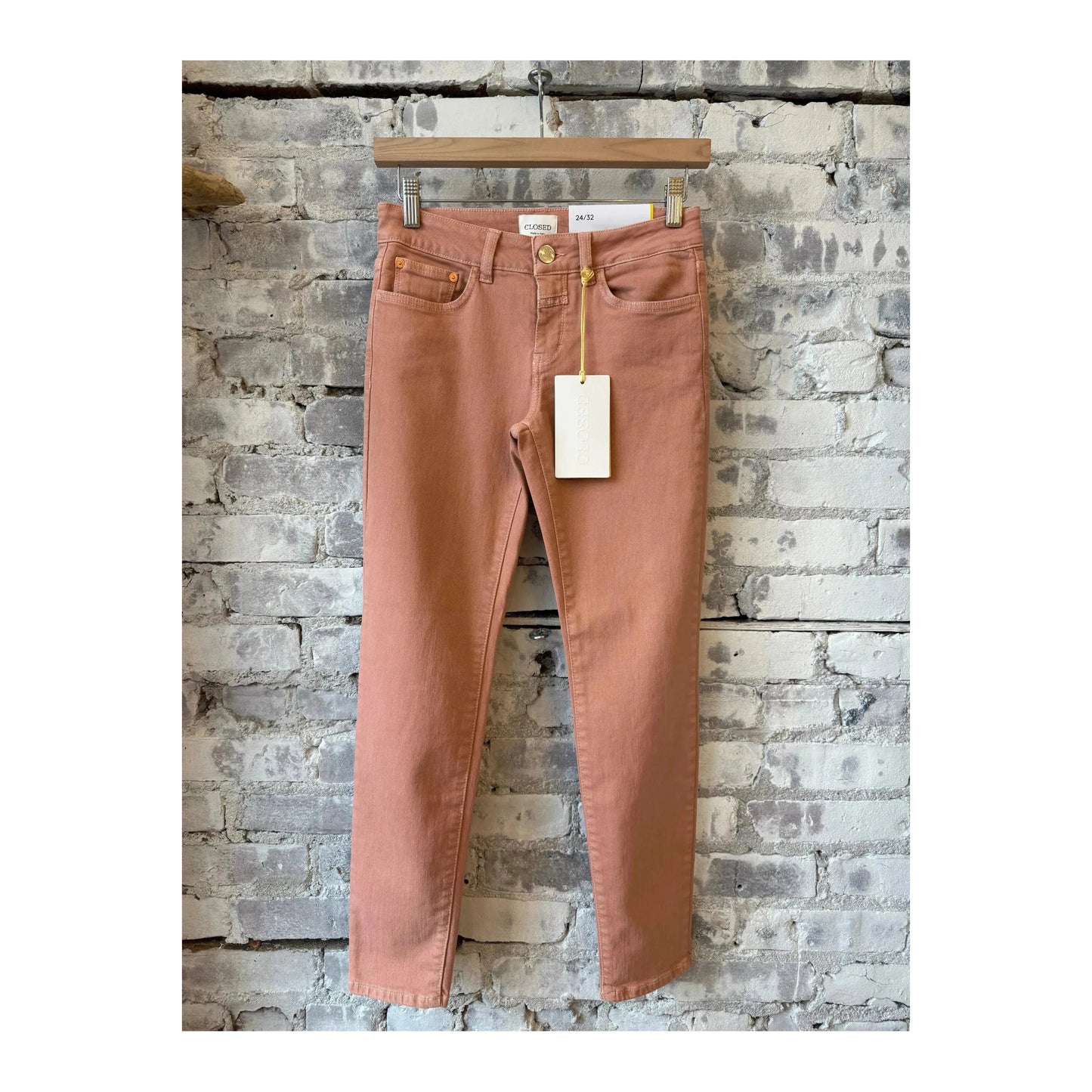 Closed Women's Baker Power Stretch Jeans in terracotta rose, showing the fitted design and stylish color on a model.