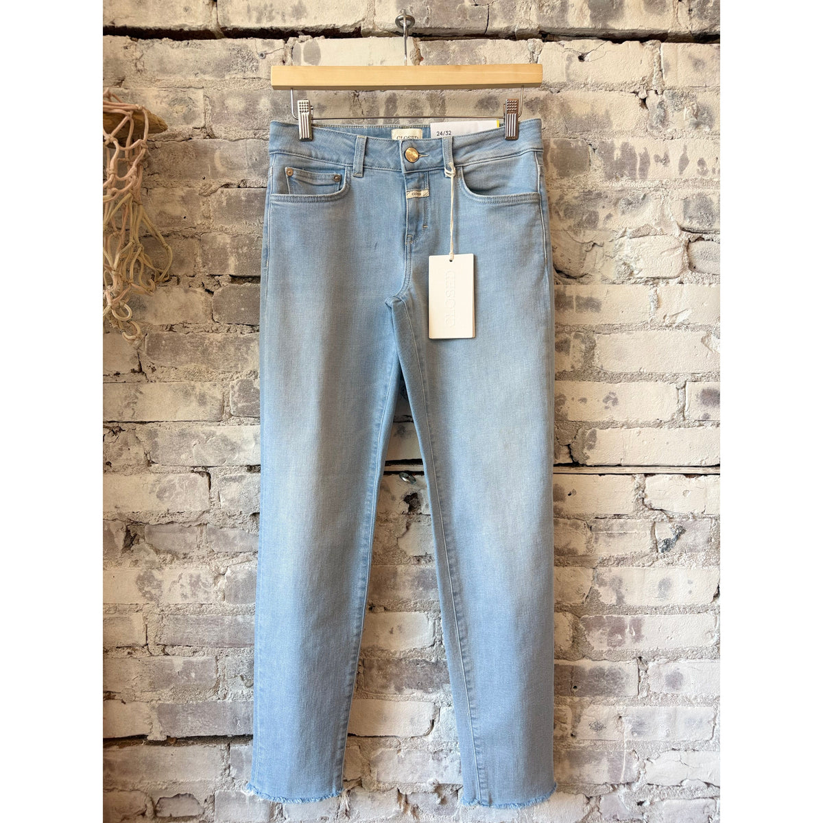 Women's Baker Slim Jean by Closed in light blue denim, showing a close-up of the fitted, slim-leg style with classic five-pocket design.