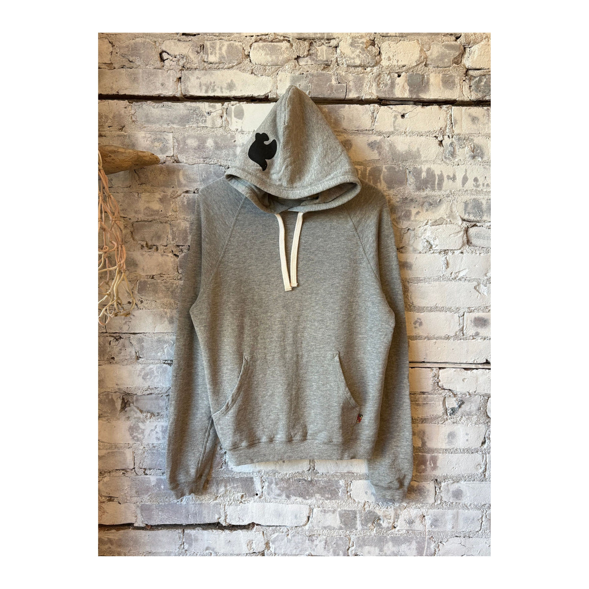 Women's Freecity BASICGOODNESS Light-Terry Fluff Hoodie in heather, showing the soft, cozy hoodie with a front pocket and adjustable drawstrings.