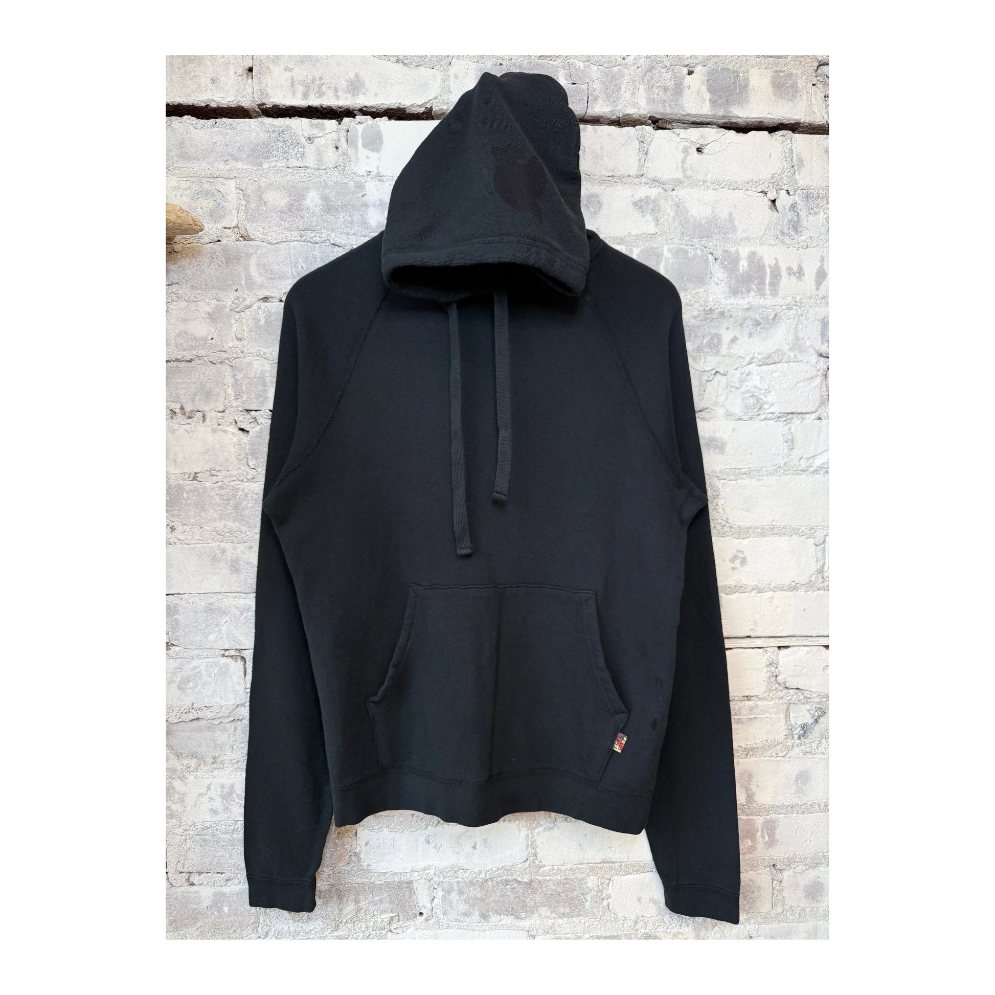 Women's Freecity BASICGOODNESS Light-Terry Fluff Hoodie in Volcano, showcasing soft fabric and relaxed fit in a vibrant orange hue.