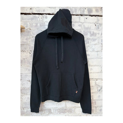 Women's Freecity BASICGOODNESS Light-Terry Fluff Hoodie in Volcano, showcasing soft fabric and relaxed fit in a vibrant orange hue.