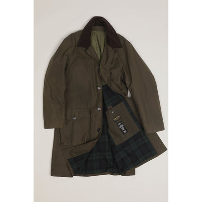 Men's green Baxter waxed cotton trench coat by East Harbour Surplus, featuring a classic design and durable waterproof material.