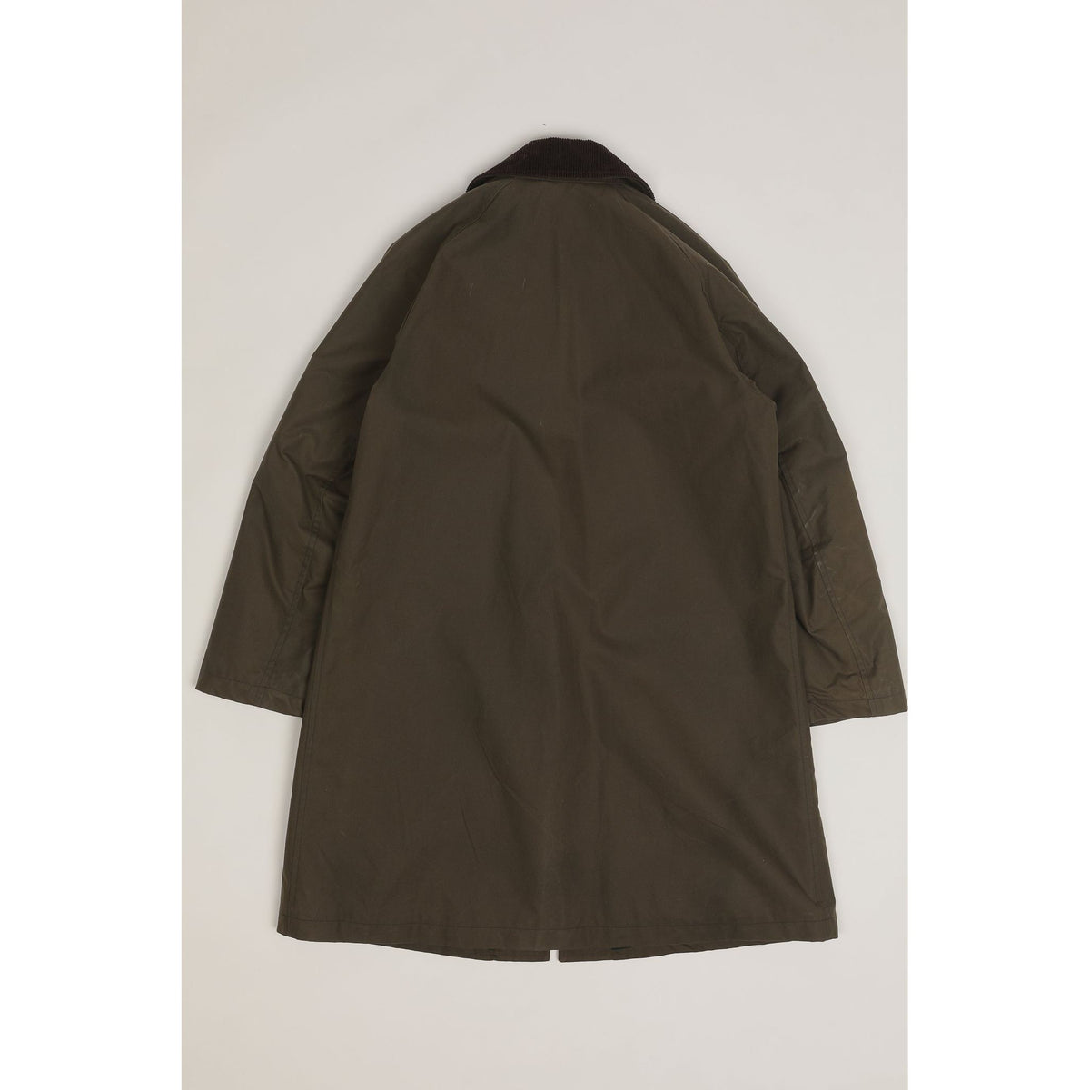 Men's green Baxter waxed cotton trench coat by East Harbour Surplus, showing the classic weather-resistant design and stylish fit.