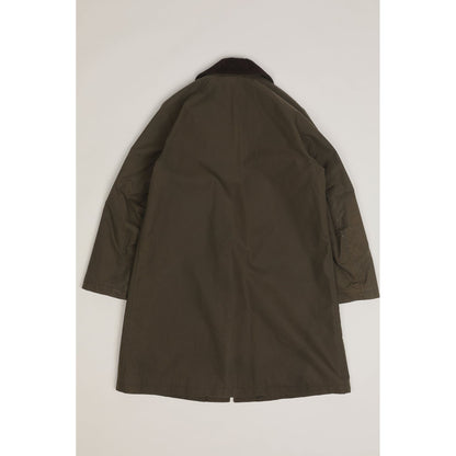 Men's green Baxter waxed cotton trench coat by East Harbour Surplus, showing the classic weather-resistant design and stylish fit.