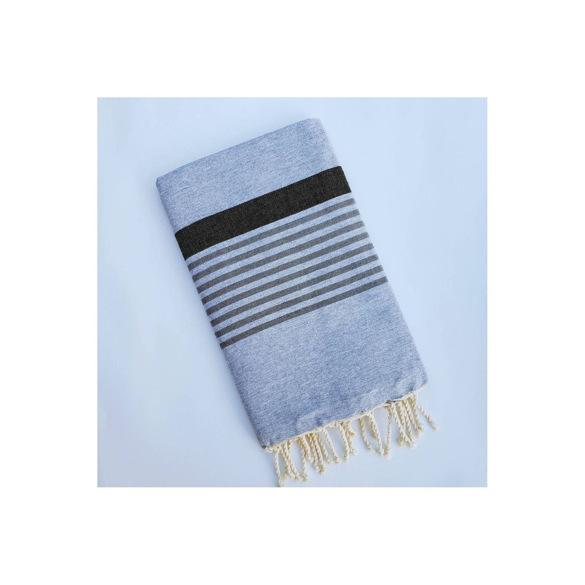 Gray and black Wonderfouta beach towel sarong with soft fabric, perfect for lounging or beach cover-up.
