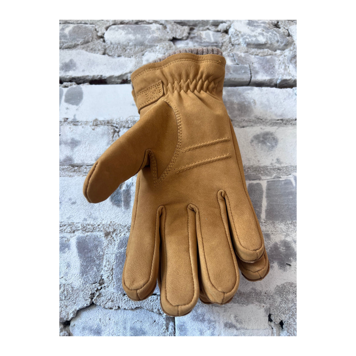 Men's Hestra Bergvik Glove in tan leather, showing the textured exterior and detailed stitching.