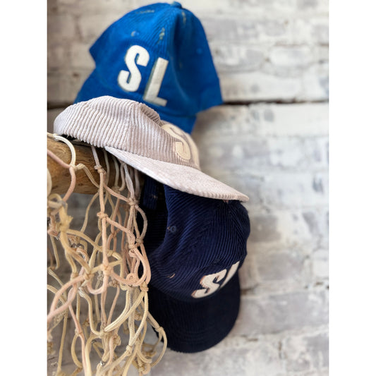 Assorted colors bleached "SL" patch letterman floppy cord hat, stylish accessories from Local Supply Club.