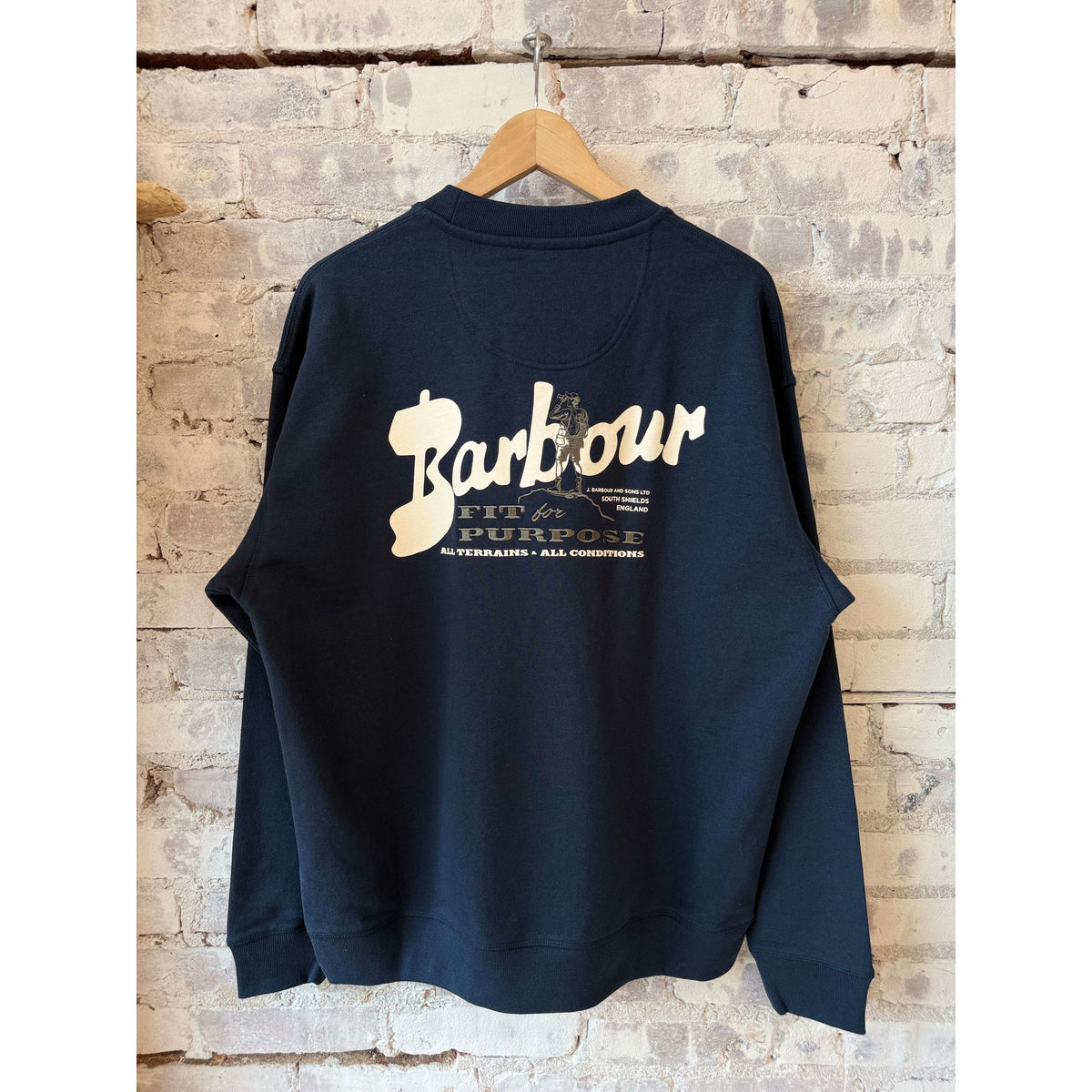 Men's navy Blythe crew neck jumper by Barbour, featuring a classic knit design and ribbed collar and cuffs.