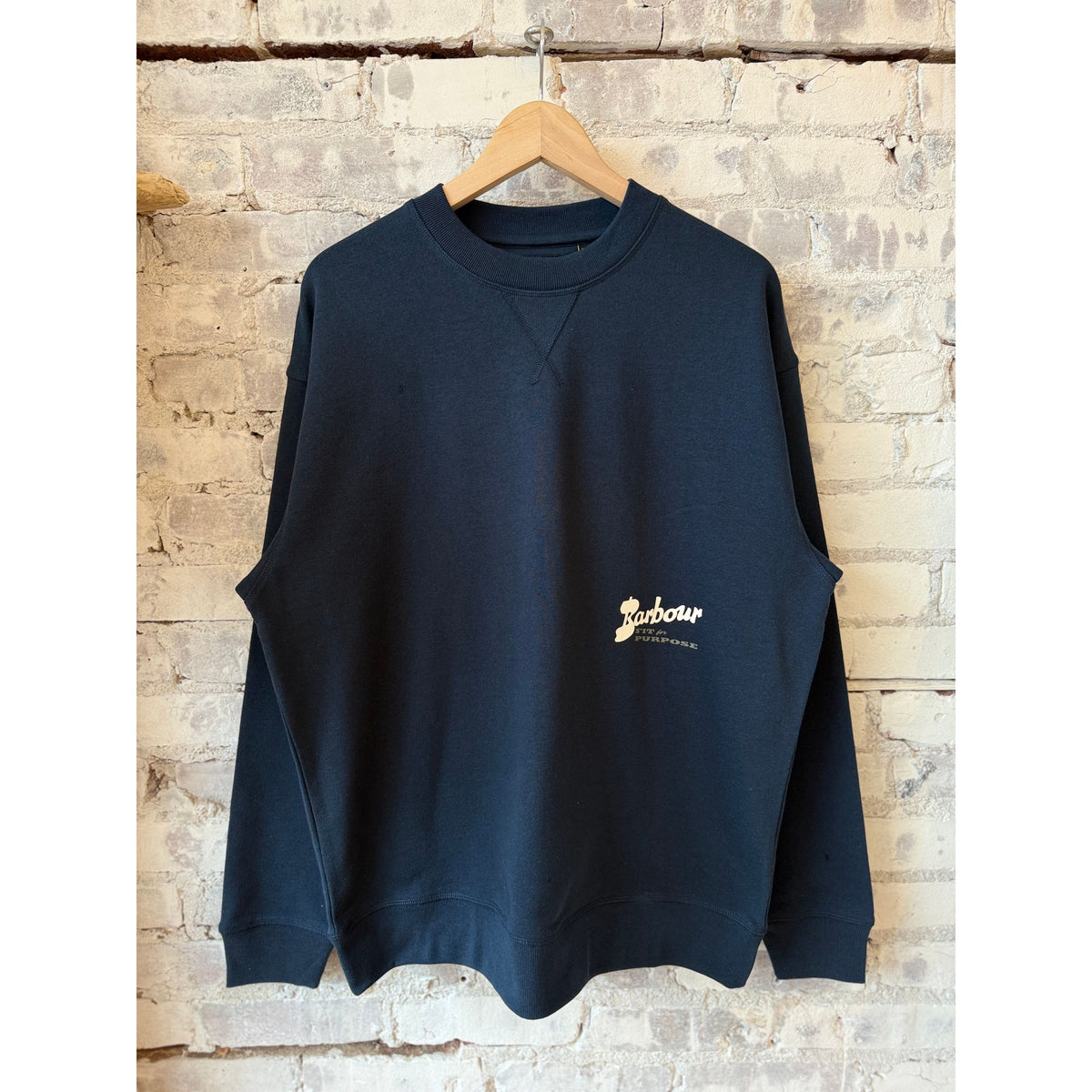 Men's navy Blythe Crew Neck Jumper by Barbour, featuring a classic knit design and ribbed collar and cuffs.