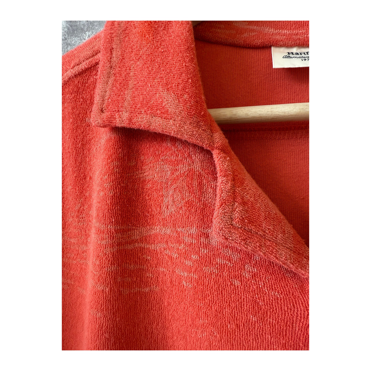 Men's Hartford Bouclette Knit Polo in terracotta, featuring textured knit fabric and a classic polo collar.