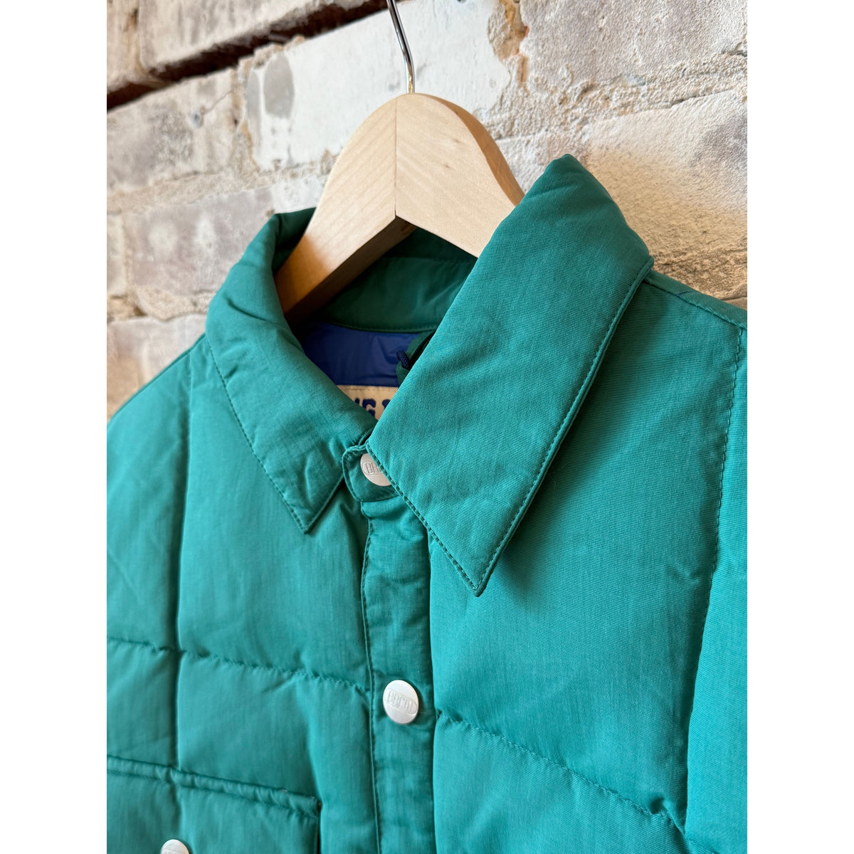 Men's Bridalveil Jacket in Spearmint by Big Rock Candy Mountaineering, shown in a close-up of the mint green outdoor jacket.