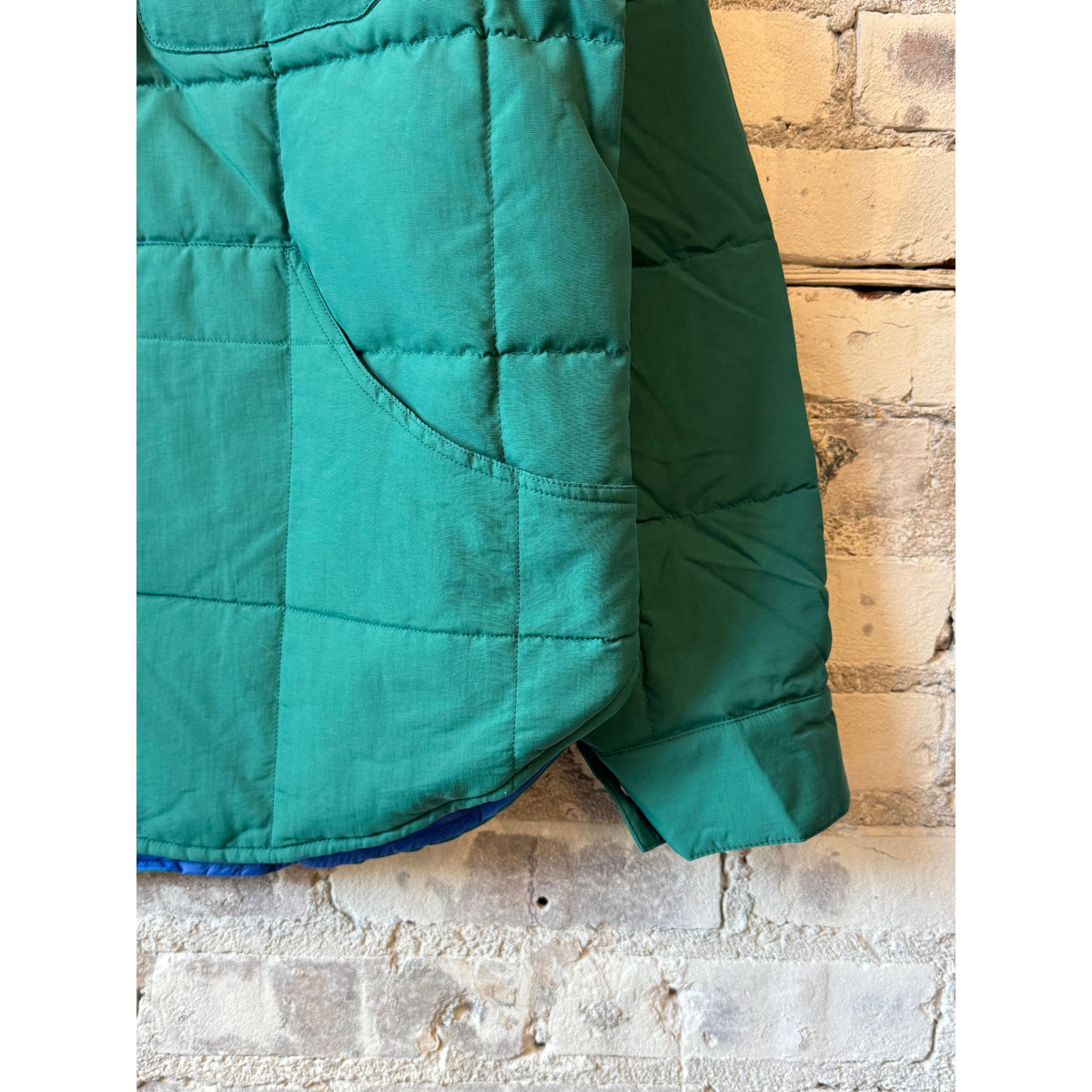 Men's Bridalveil Jacket in spearmint by Big Rock Candy Mountaineering, shown in a close-up view of the jacket's fabric and color.