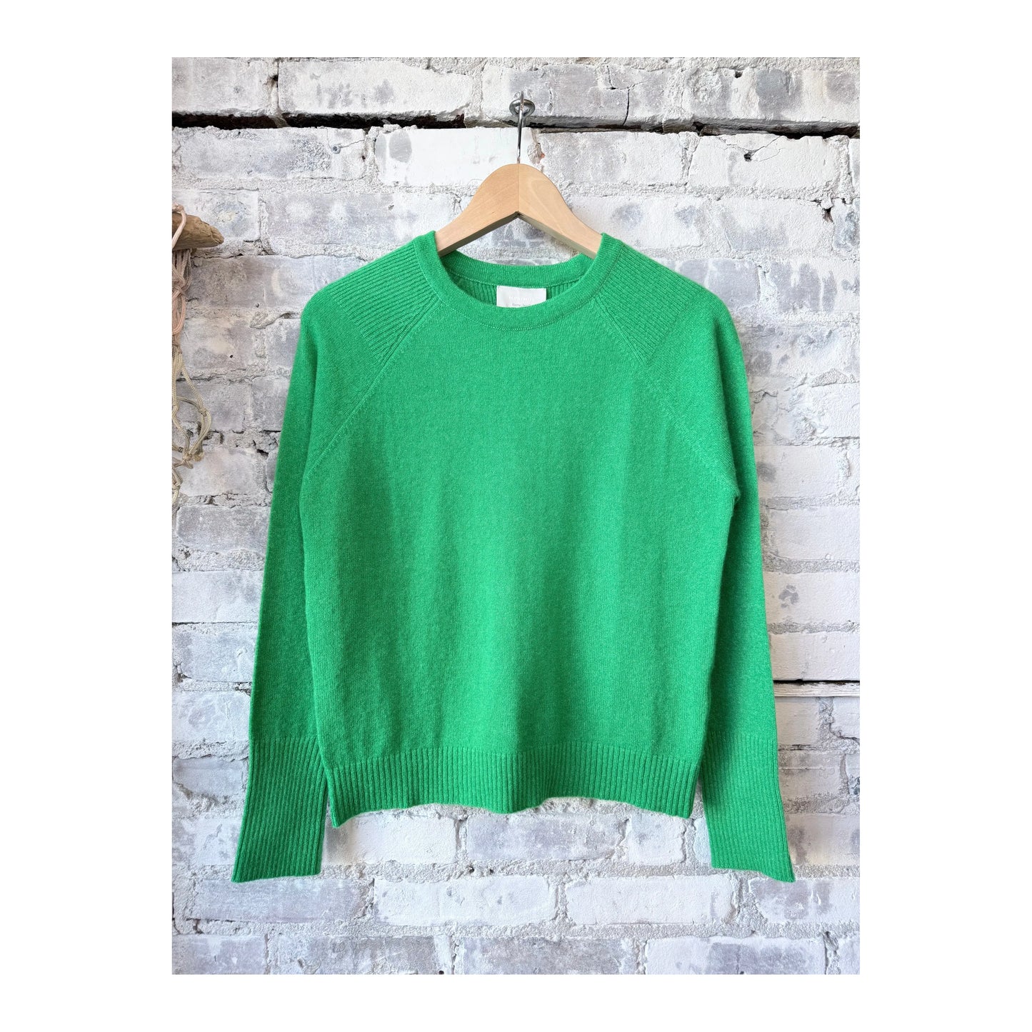 Women's Brighton Pullover in Tanager by M.Patmos, featuring a cozy knit fabric and relaxed fit, displayed on a model.