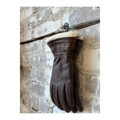 Women's Buvika deerskin glove in chocolate by Hestra, showcasing the soft leather and detailed stitching.