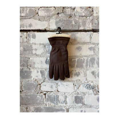 Women's Hestra Buvika deerskin glove in chocolate color, showcasing the soft leather and stylish design.
