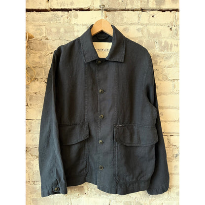 Men's Magma Black cargo jacket by Closed Men's, featuring multiple pockets and a durable fabric, displayed on a hanger.