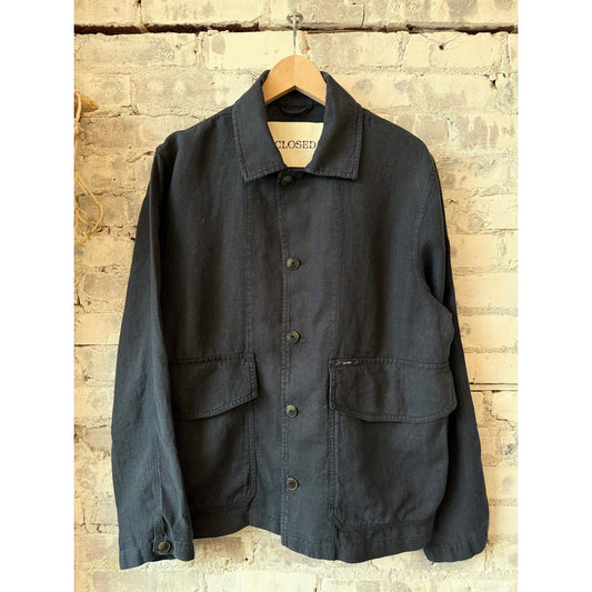 Men's Magma Black cargo jacket by Closed Men's, featuring multiple pockets and a durable fabric, displayed on a hanger.