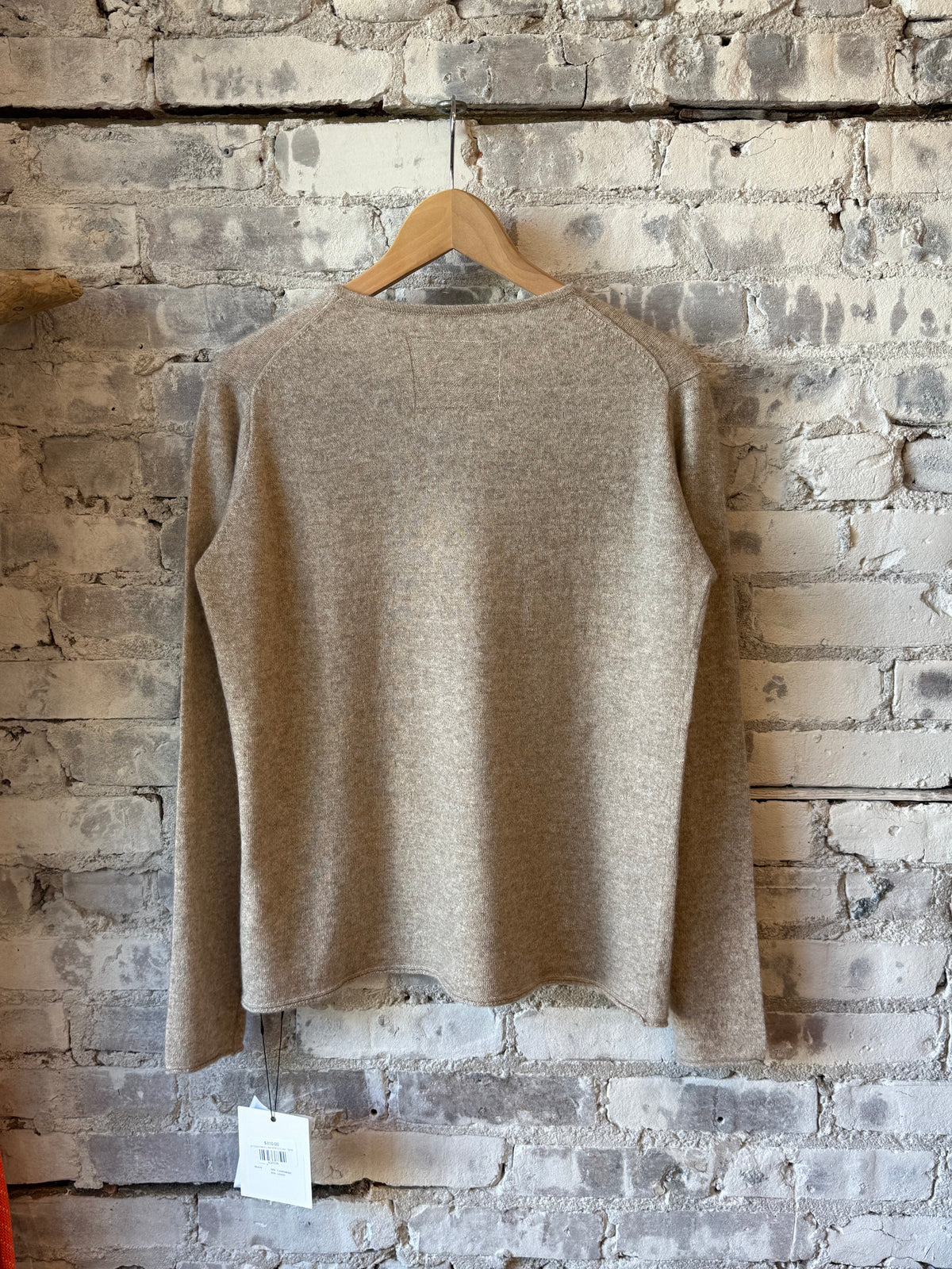 Women's cashmere linen knit long-sleeve crew neck top in sand color from V::Room, showcasing soft, lightweight fabric and relaxed fit.