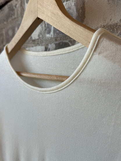 White women's cashmere silk jersey long-sleeve crew neck top by V::Room, soft and luxurious fabric, close-up of fabric texture
