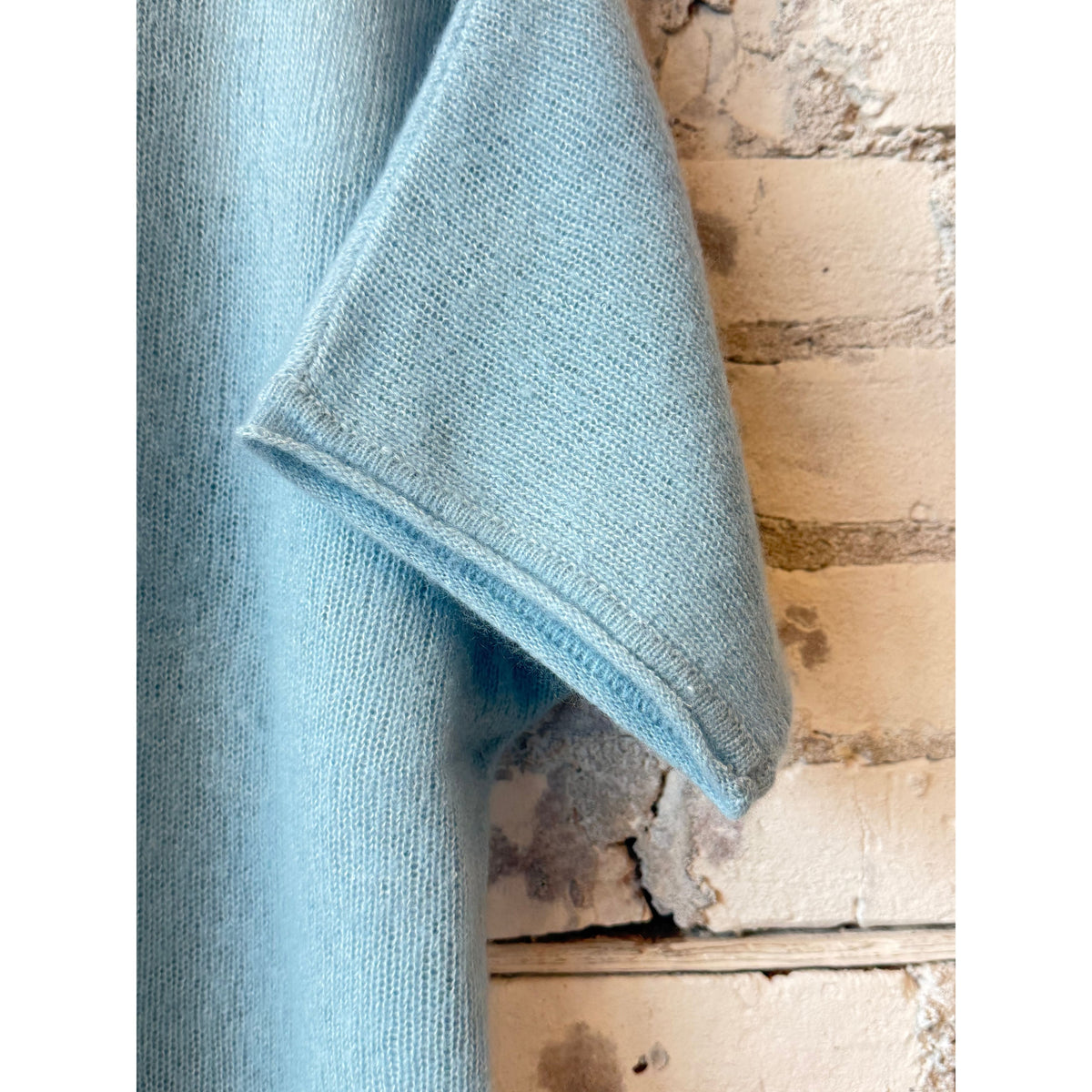 Women's cashmere silk short-sleeve crewneck top in Bleu Calanques by Majestic Filatures, shown in a close-up of the fabric and neckline.