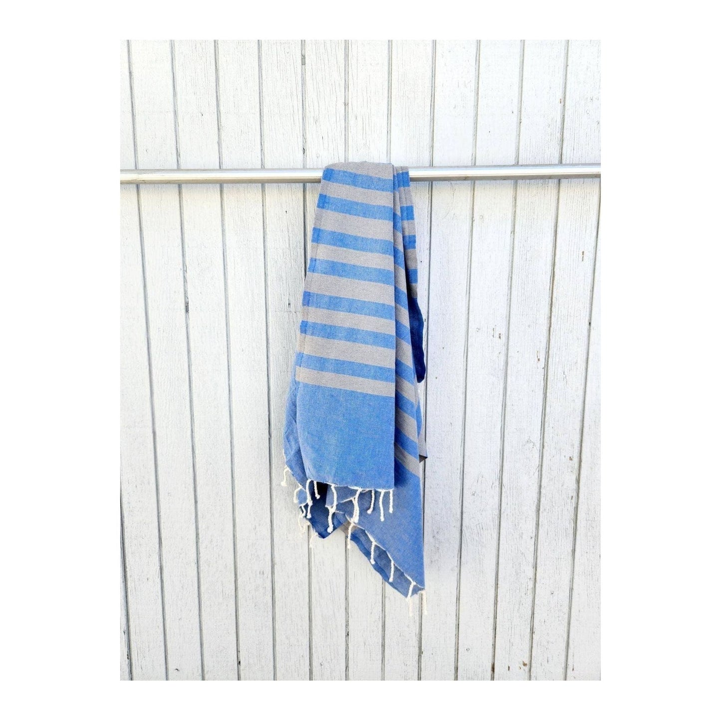 Wonderfouta Turkish beach towel sarong in blue stone pattern, showcasing lightweight, vibrant fabric perfect for beach or poolside use.