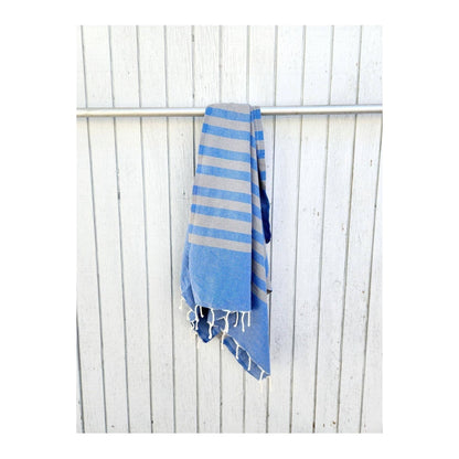Wonderfouta Turkish beach towel sarong in blue stone pattern, showcasing lightweight, vibrant fabric perfect for beach or poolside use.
