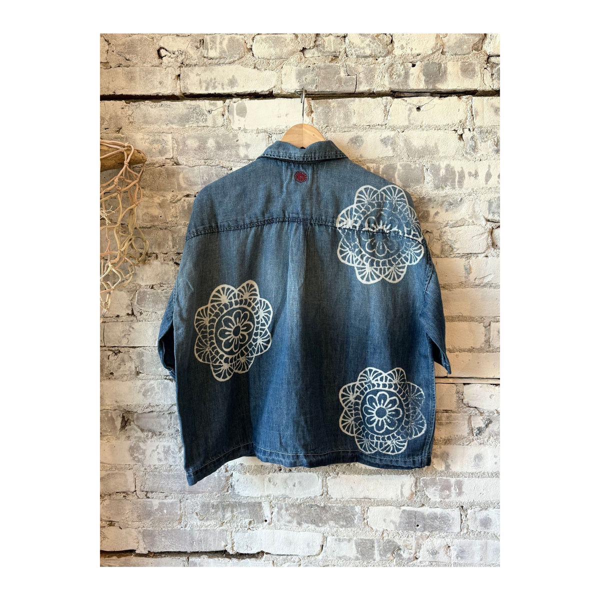 Women's chambray cropped military shirt by MONOSTERO with medallion print, featuring a casual button-up design and short sleeves.