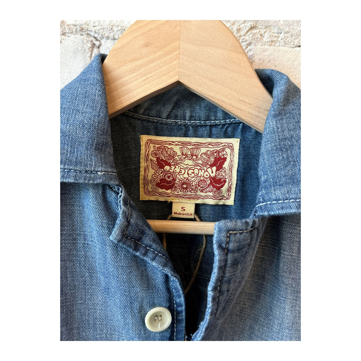 Women's Chambray Cropped Military Shirt by MONOSTERO with medallion print, featuring button details and short sleeves.