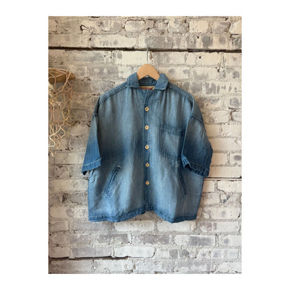Men's light indigo chambray cropped shirt by MONOSTERO, featuring a casual fit and button-front design.