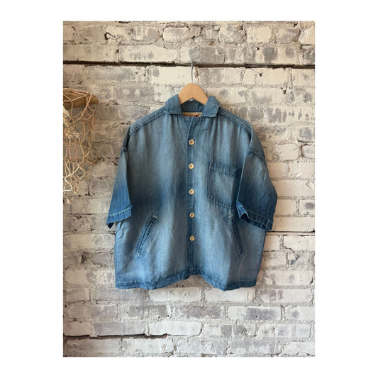 Men's light indigo chambray cropped shirt by MONOSTERO, featuring a casual fit and button-front design.