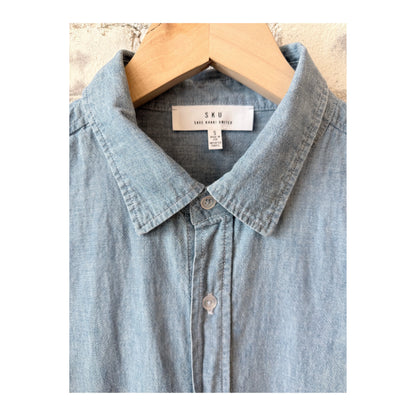 Men's chambray shirt in chambray blue by Save Khaki United, featuring a classic button-up style and casual fit.