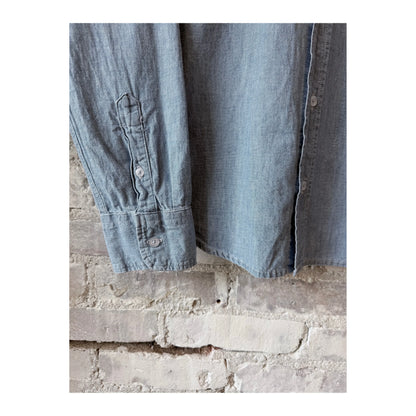 Men's chambray shirt in blue by Save Khaki United, featuring a classic button-up design and casual fit.