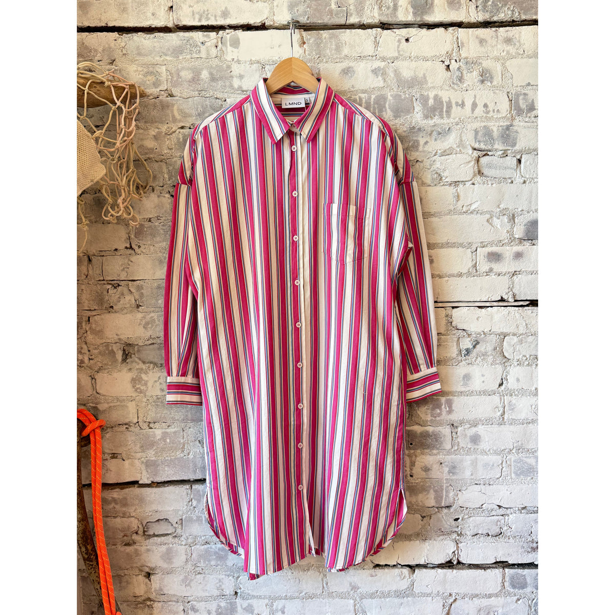 Women's Chiara Midi Dress by LMND in vibrant fuchsia with colorful stripe pattern, featuring a fitted silhouette and stylish design.